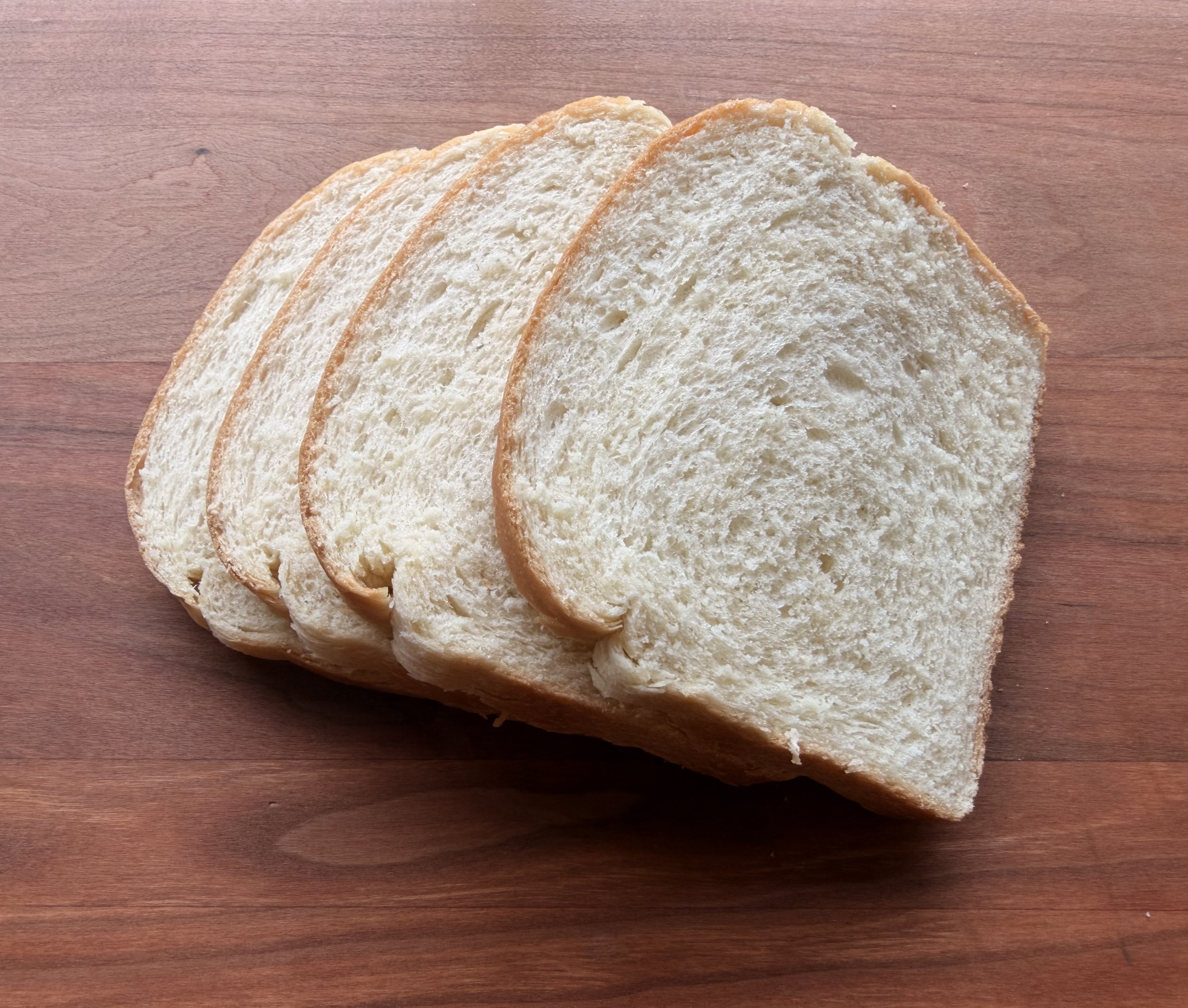 A sliced loaf of white bread